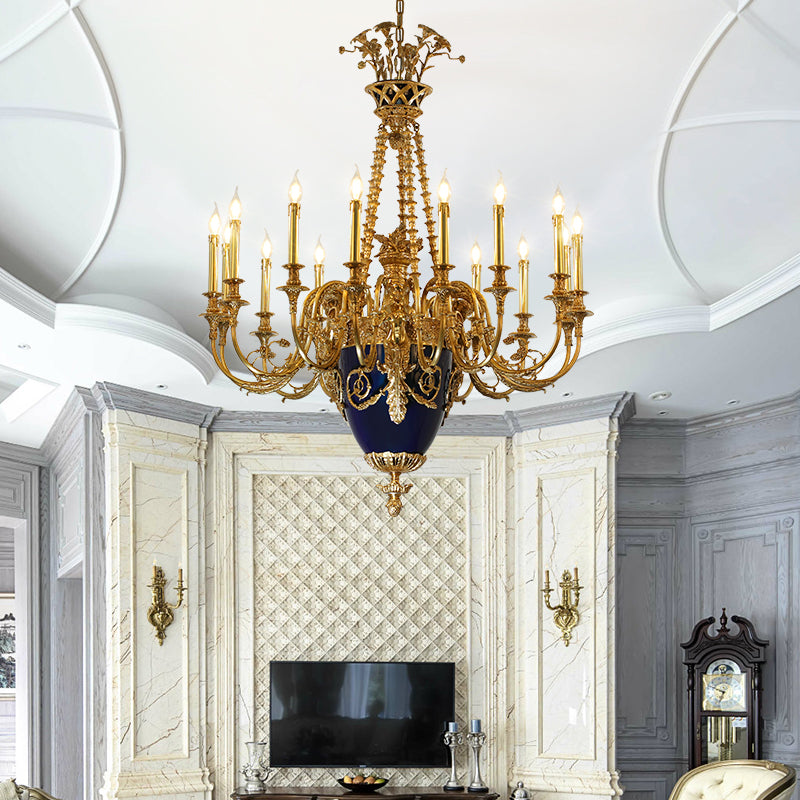 The luxury brass chandelier installed in a modern classic living room with a marble TV wall.
