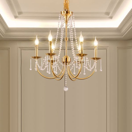 A european chandelier installed in a sophisticated dining room with paneled walls and a polished wooden table.