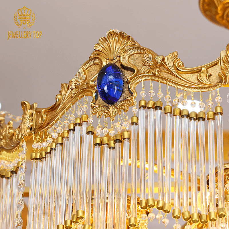 Macro close-up of the deep blue sapphire-like crystal embellishments embedded in the ornate golden frame.