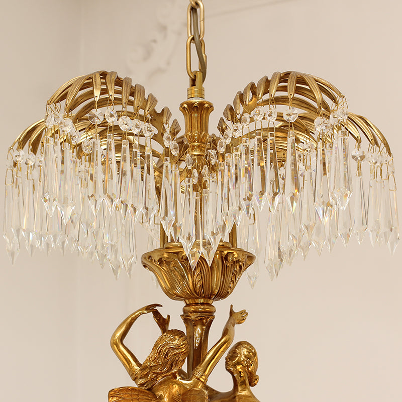 Full side view of a sculptural French brass chandelier with figures supporting crystal tiers.