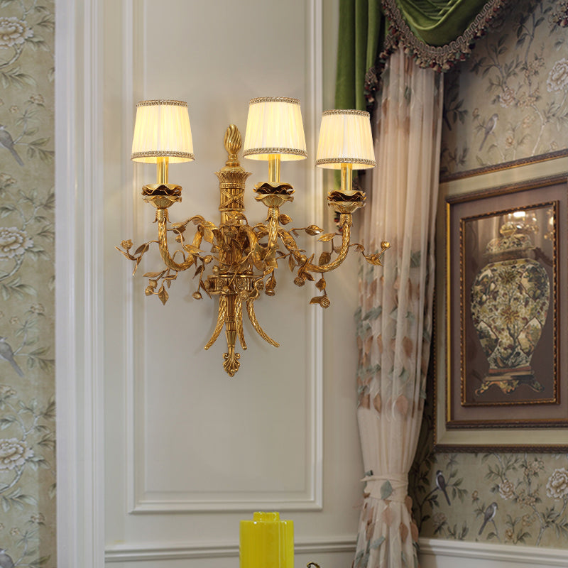 The French castle wall light installed on a light-colored wall with green curtains and a decorative painting.