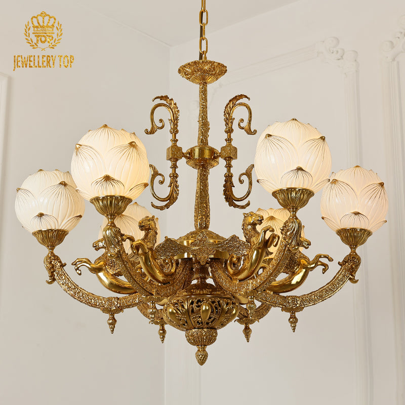 A luxury chandelier installed in a grand residence hallway with classic wall paneling and a decorative archway.
