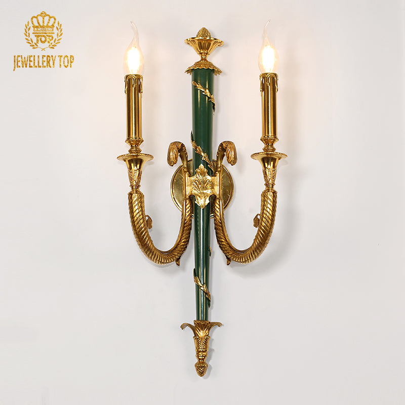 Detailed macro view of the sconce’s central jade green ceramic column with applied gold leaf laurel wreath decoration.