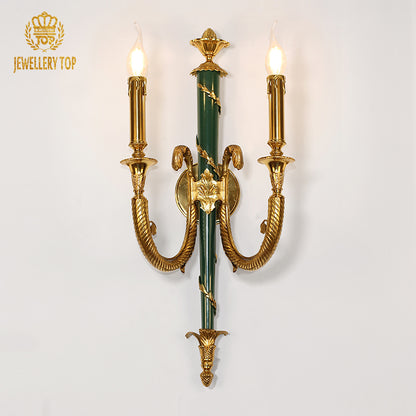 Detailed macro view of the sconce’s central jade green ceramic column with applied gold leaf laurel wreath decoration.