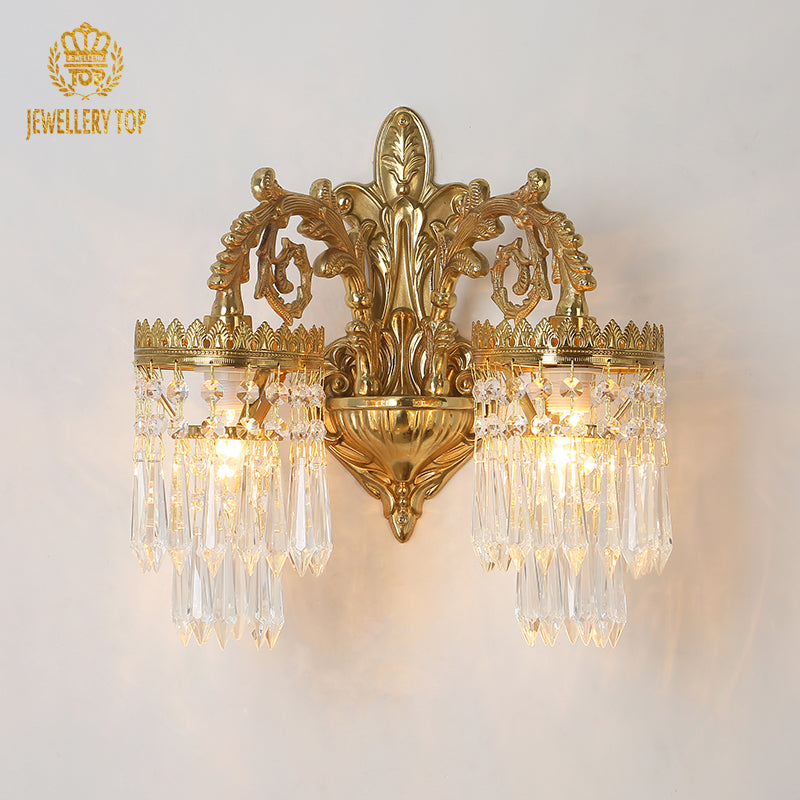 JEWELLERY TOP branded product close-up, showcasing the ornate crown design and crystal details of the brass sconce.