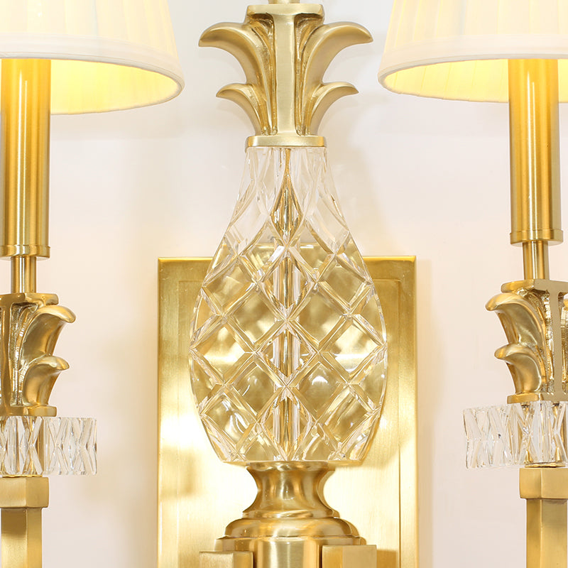 Detailed view of the wall mounting plate and the connection point, highlighting the solid brass construction and finish.