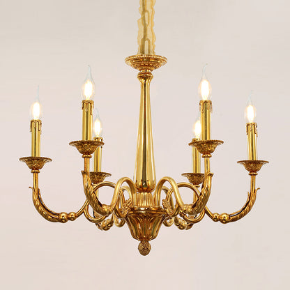 Close-up detail of a luxurious brass chandelier arm with textured finish and bulb.