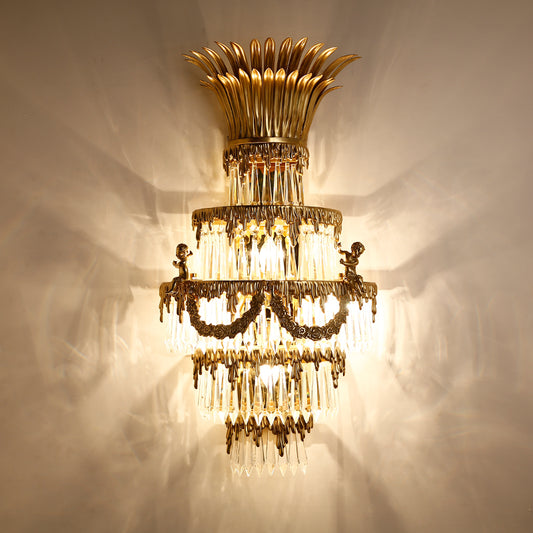 The ornate French hotel wall lamp with a sunburst top and angel sculpture, installed on a luxurious wall.