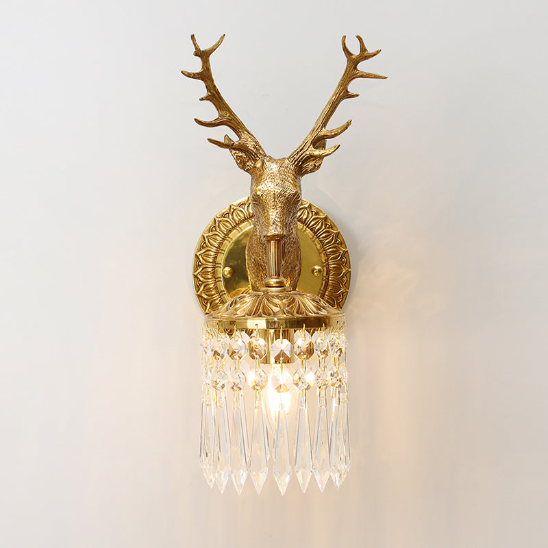 Front-facing close-up of the home decorative brass wall light, highlighting the stag’s sculpted features and crystal cascade.