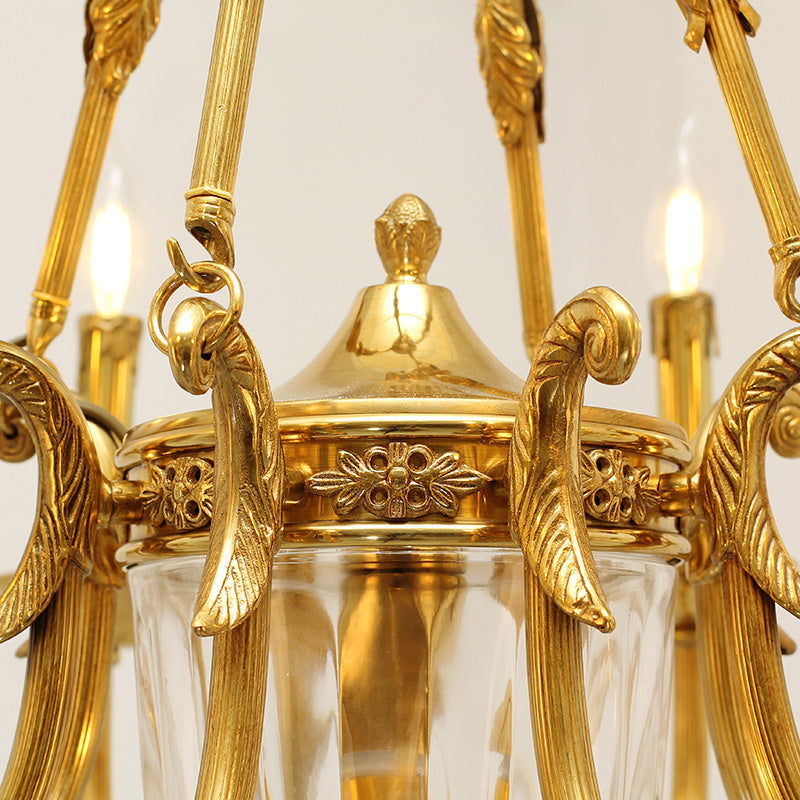 Extreme detail shot focusing on the candle-shaped filament bulbs and the decorative brass canopy at the top.