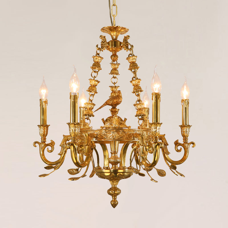 Front view of JEWELLERY TOP's golden brass chandelier featuring a central bird sculpture.