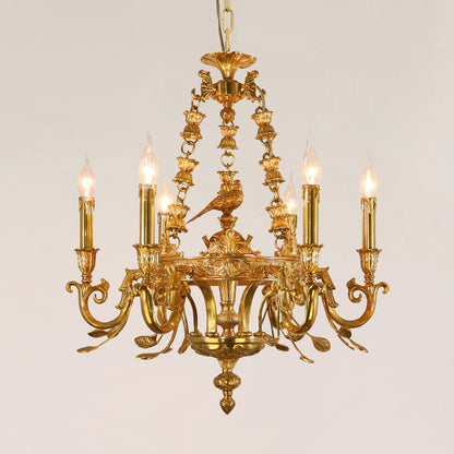 Front view of JEWELLERY TOP's golden brass chandelier featuring a central bird sculpture.