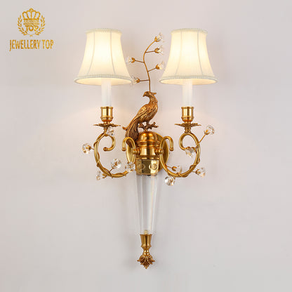 The European antique wall light installed on a classic wall, emitting a warm glow beside elegant home decor.