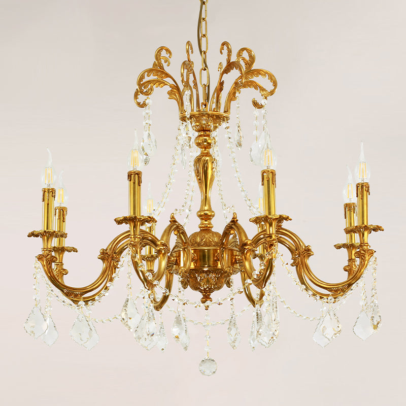 French-style brass chandelier with a floral center and cascading crystal drops.