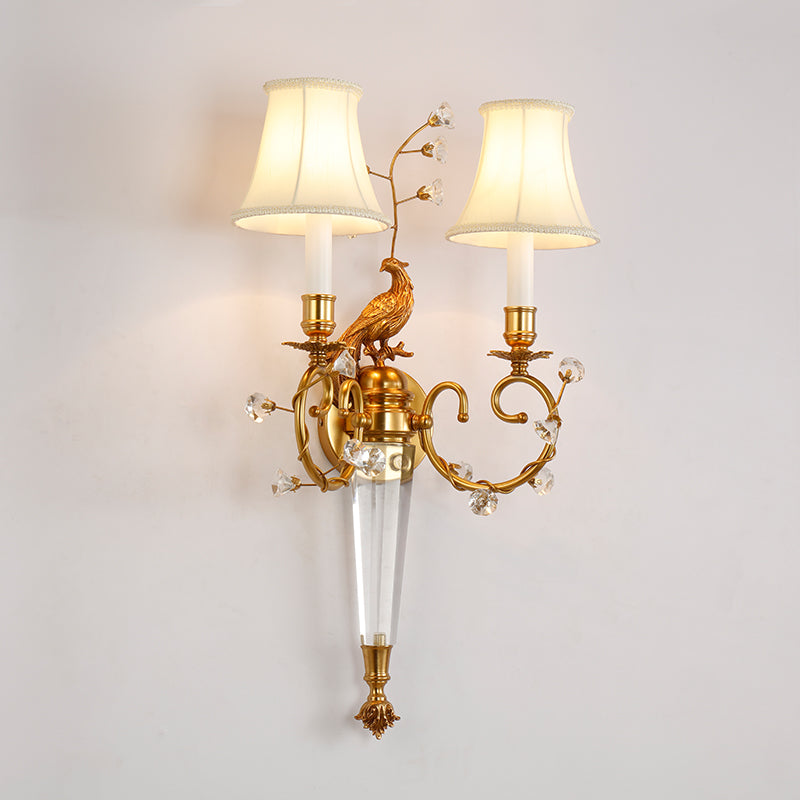 JEWELLERY TOP branded brass sconce featuring a bird, crystal details, and two fabric lampshades.