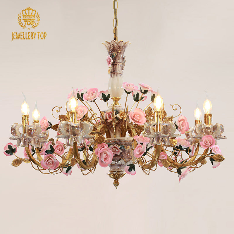 JEWELLERY TOP brand's brass and ceramic flower chandelier, side view on white.