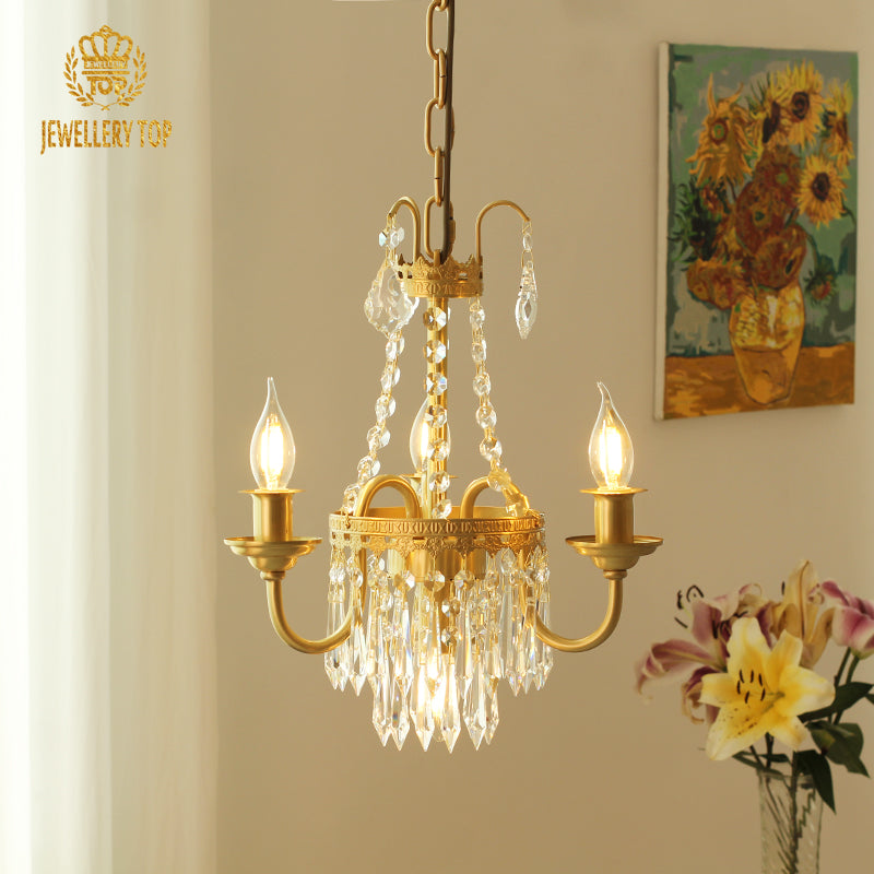 Rive Gauche Café Lumière brass chandelier in a room with sunflower art and lilies, brand JEWELLERY TOP.