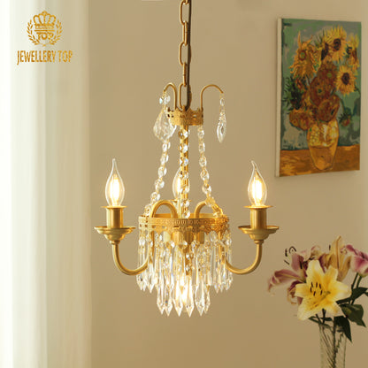 Rive Gauche Café Lumière brass chandelier in a room with sunflower art and lilies, brand JEWELLERY TOP.