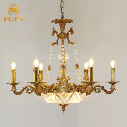 Front view of JEWELLERY TOP's golden brass chandelier with candle bulbs and a crystal centerpiece.