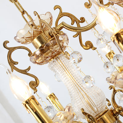 Macro close-up of the amber-tinted, ribbed glass elements and the ornate candle drip tips.