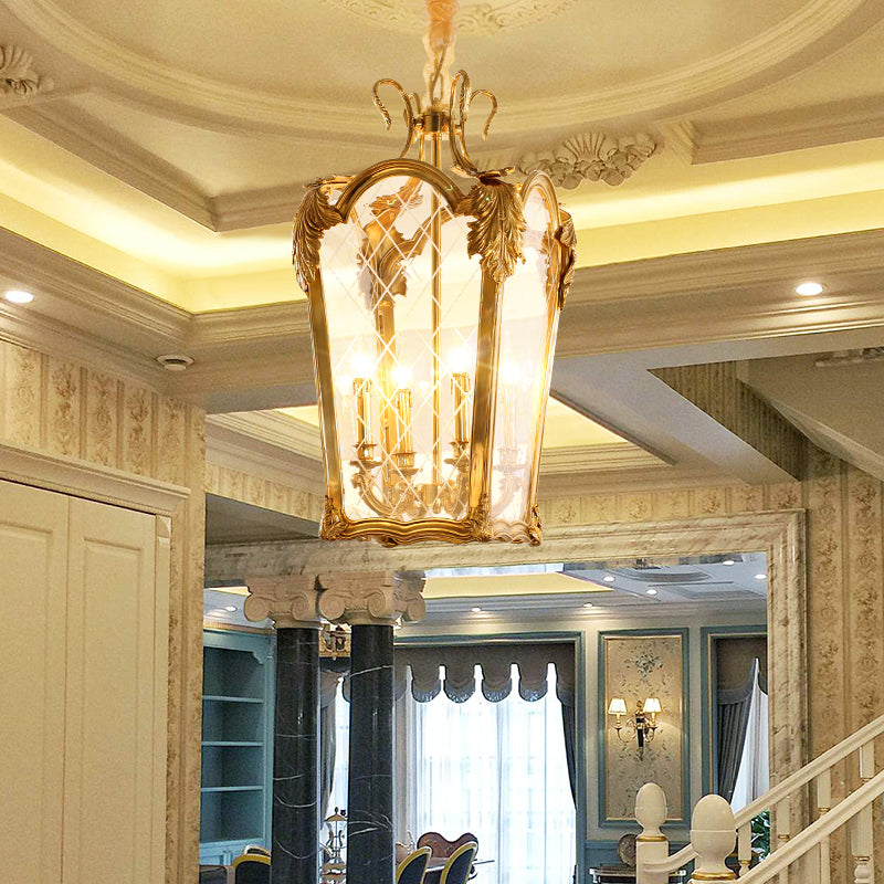 A luxury brass pendant light installed in a room with high ceilings, arches, and classic decor.