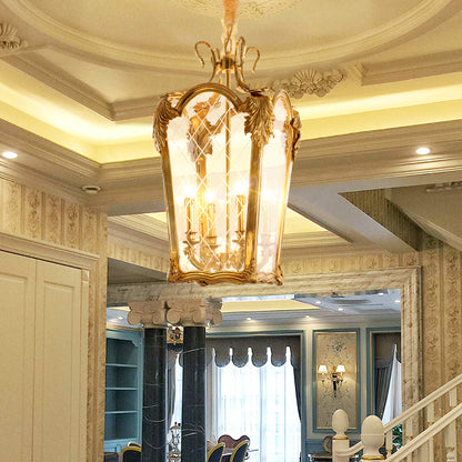 A luxury brass pendant light installed in a room with high ceilings, arches, and classic decor.