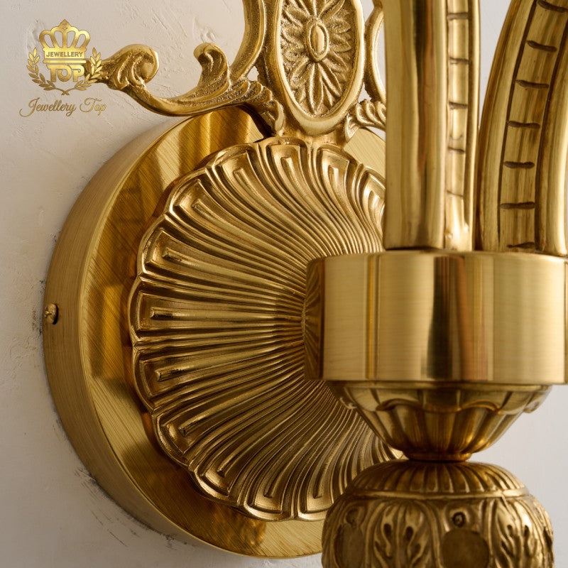 Discover the meticulous classical relief casting on the brass backplate of The Athena wall sconce by Jewellery Top. Unmatched quality for luxury homes.