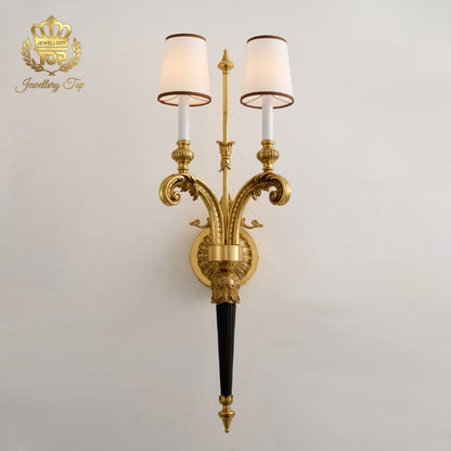 Admire the sculptural depth of our Athena brass and bronze wall sconce. Jewellery Top delivers premium Victorian lighting for high-end spaces.