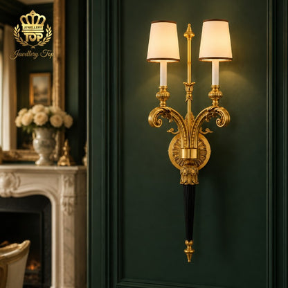 See how The Athena wall sconce by Jewellery Top elevates dark interiors. A perfect solid brass and bronze lighting statement for luxury living rooms.